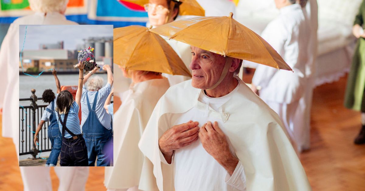 A group of older adults performing in a dance show. In the foreground, a man wears a gold umbrella hat and white cloak, surrounded by others in similar costumes. Superimposed is a smaller image showing people in blue-striped tops and dungarees dancing beside a river, one holding a colourful decorated ball.