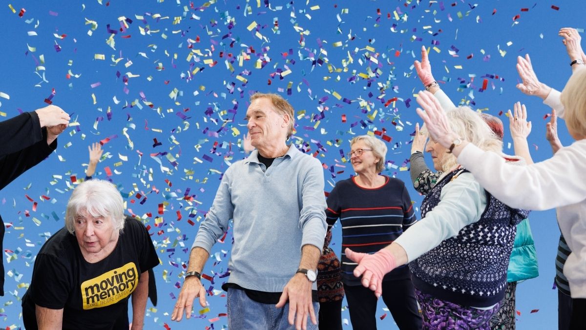 A group of older adults dancing and moving joyfully with confetti falling around them against a bright blue background.